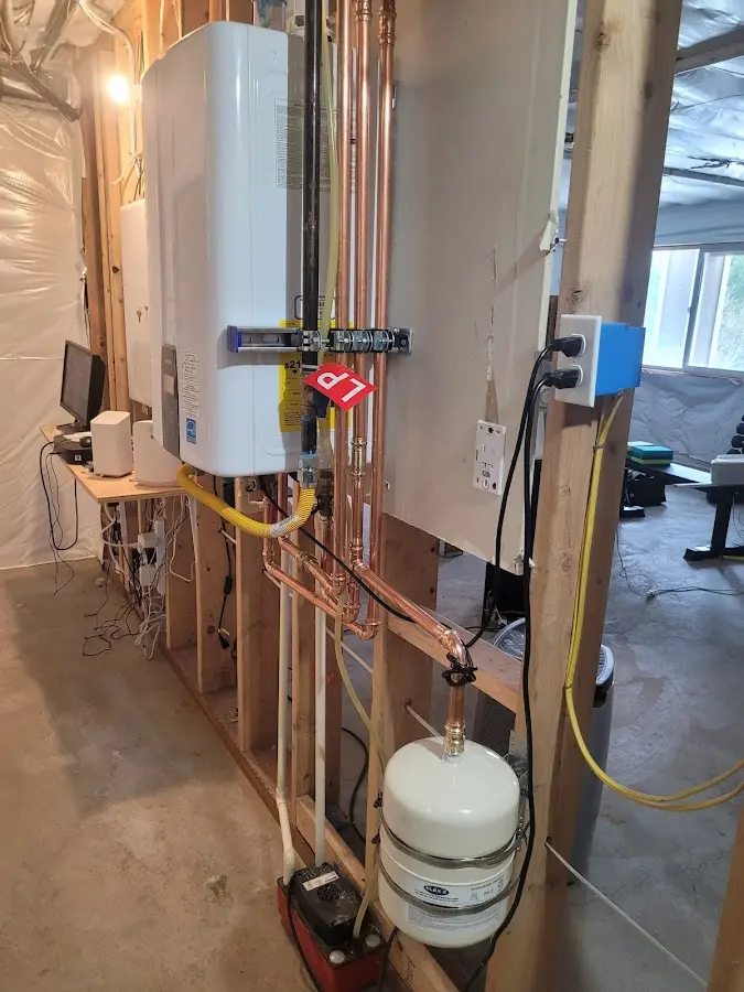 Licensed plumber repairing a kitchen sink in Freetown